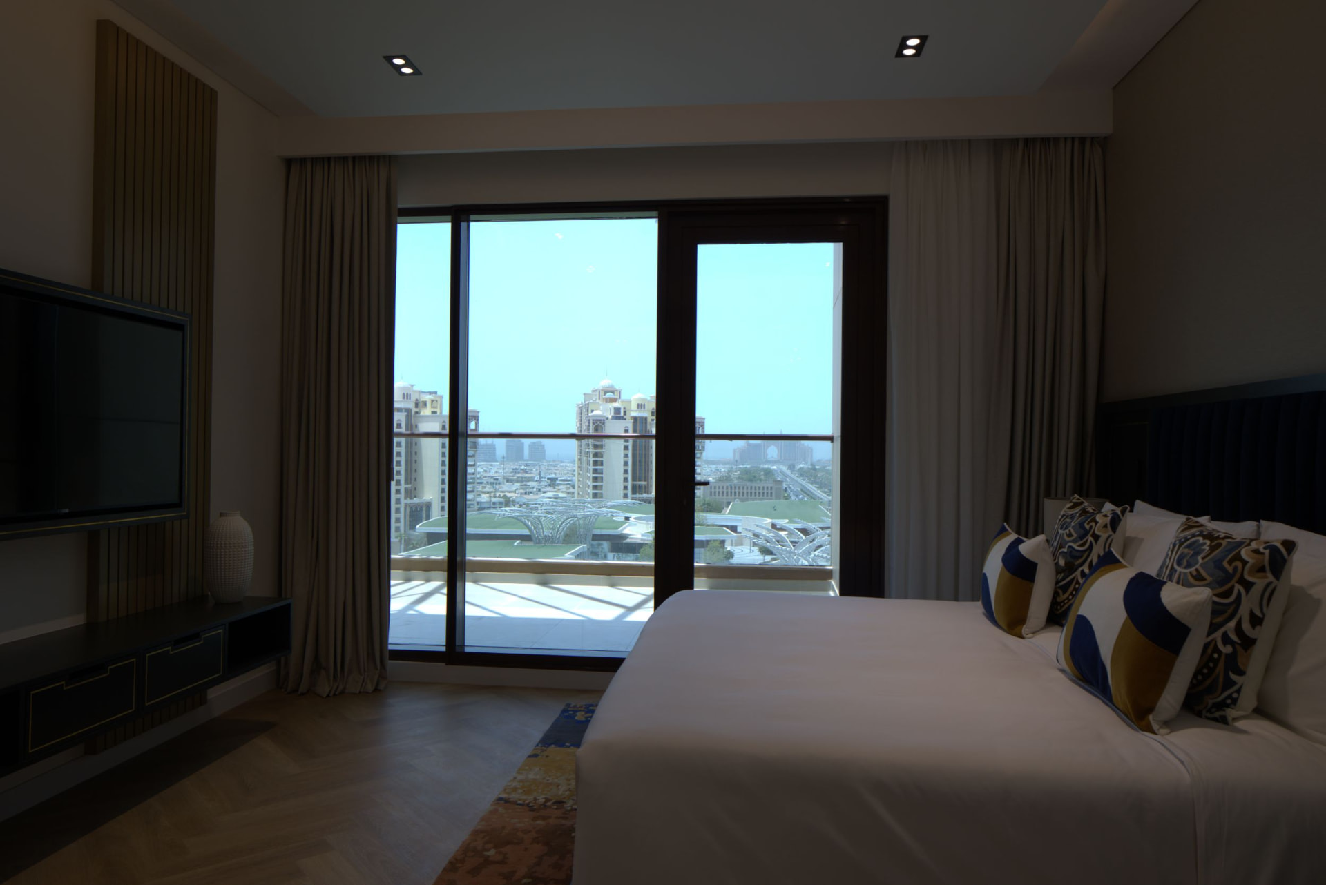 Cheval Maison The Palm master bedroom before the photography refresh — underexposed interior with cold colour cast