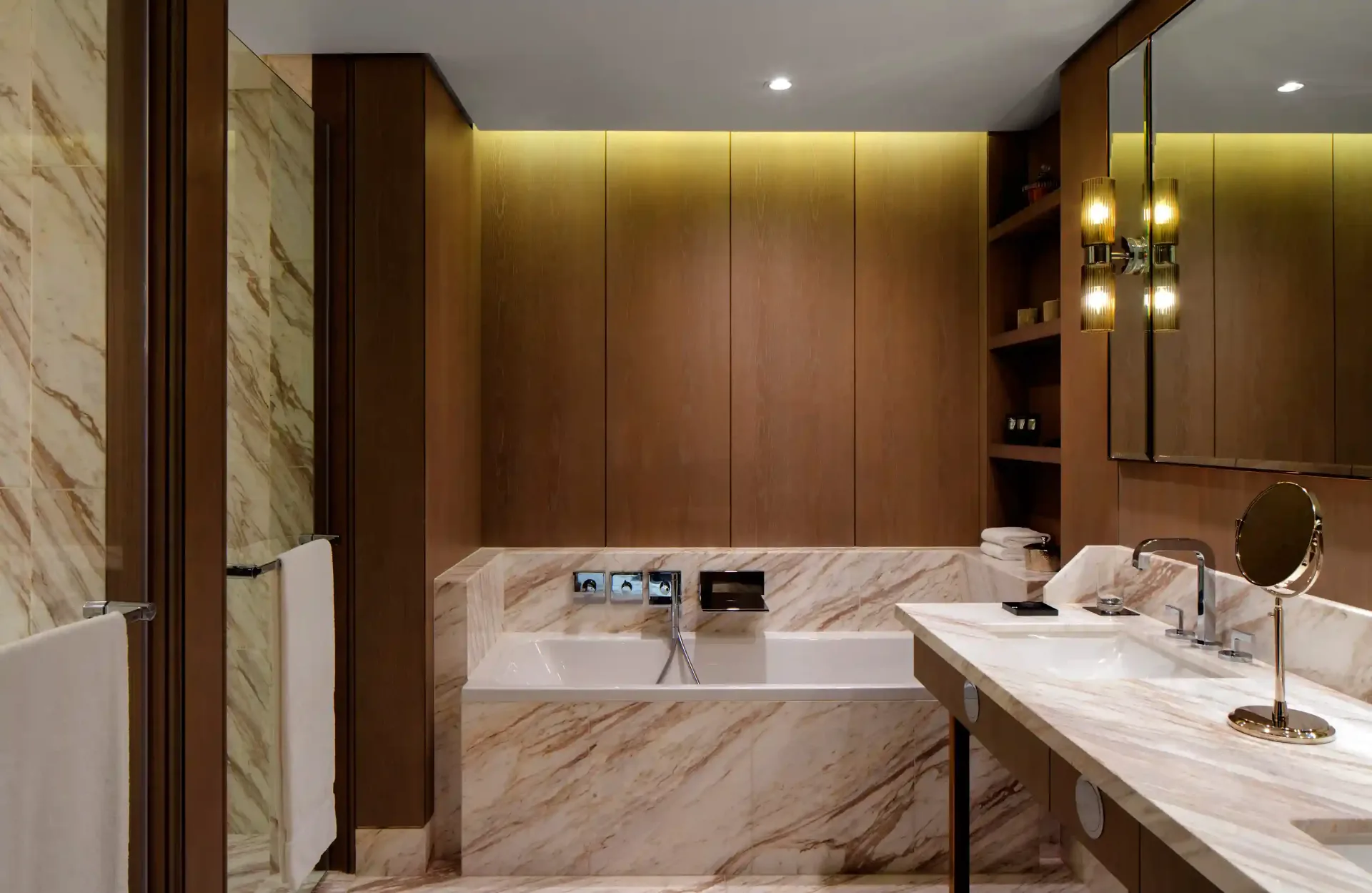Marble hotel bathroom detail photographed in controlled light before opening