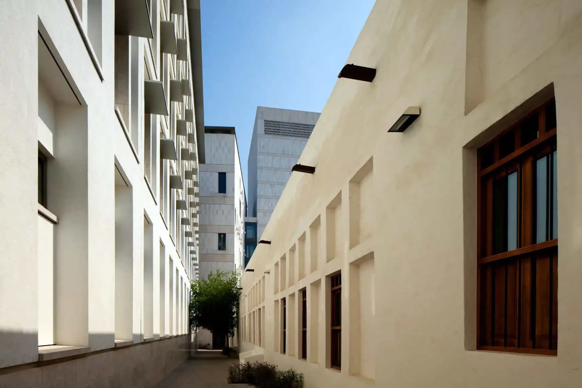 Shaded alleyway in Msheireb, Doha, where heritage walls meet contemporary detailing