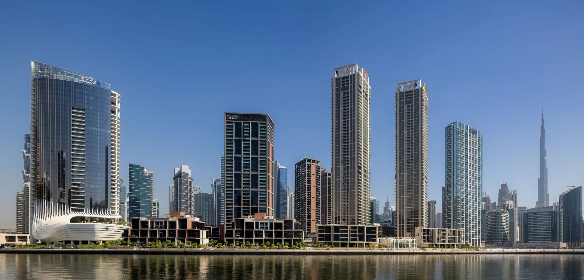 Panoramic exterior view of the Dubai skyline showing hotel towers at dusk