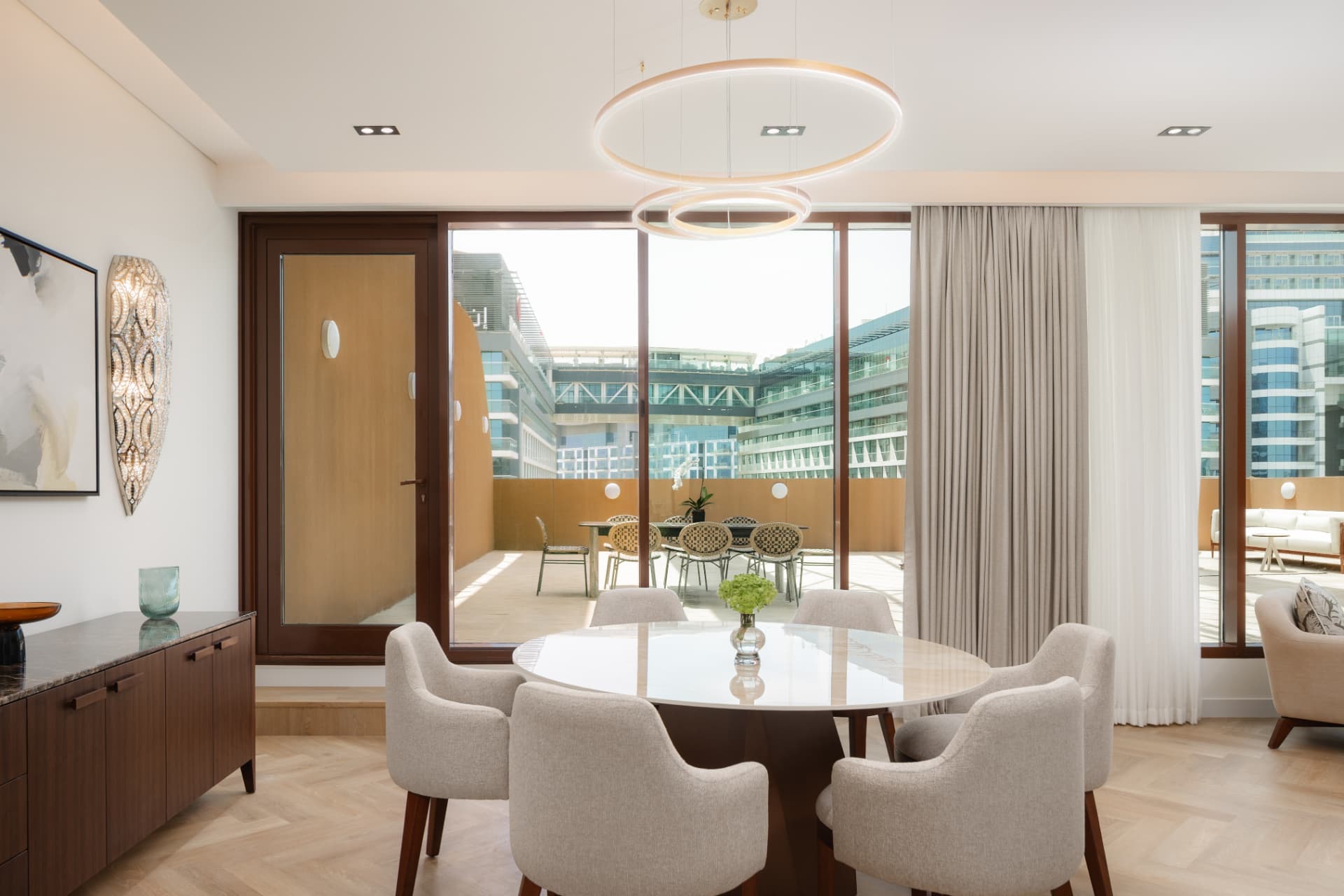 Cheval Maison The Palm dining room after the photography refresh — even interior exposure with terrace and skyline retained